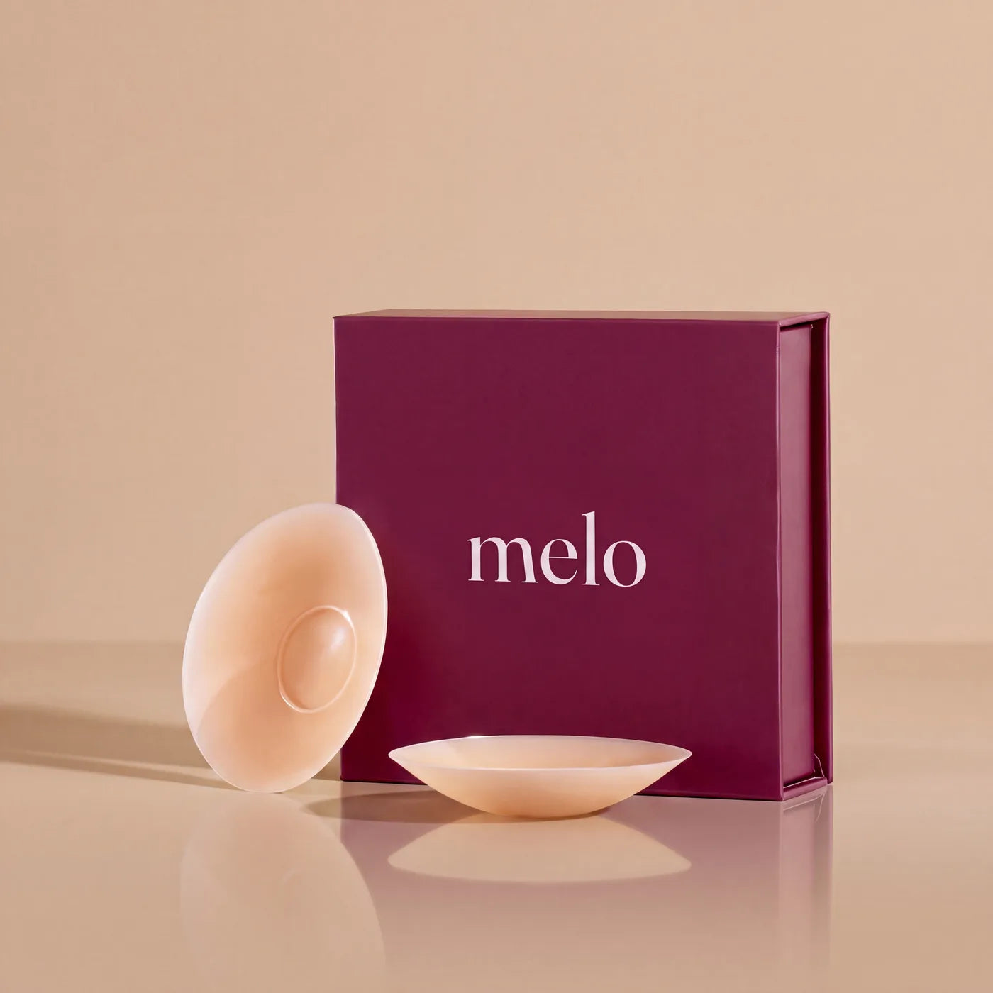 melo doughnut cover, side and top — the adhesive sits around the outer ring while the domed centre stays soft and glue-free